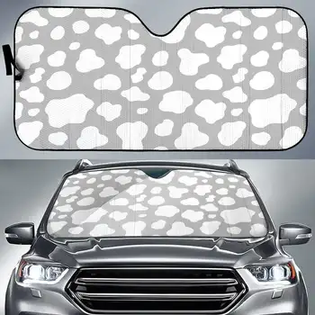 Солнцезащитный козырек для автомобиля с бело-серым рисунком коровы.